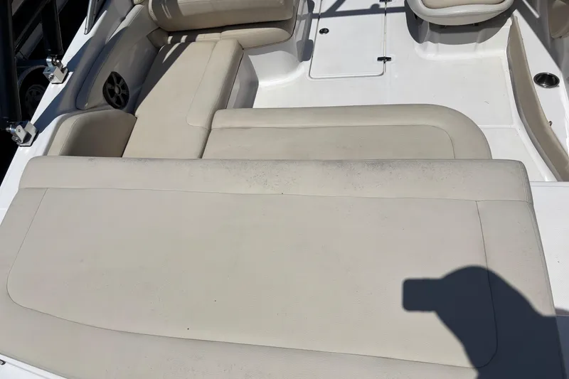 Slide: The Image of 2018 Regal 1900 ES Bowrider interior with beige seating and speaker detail. - 13