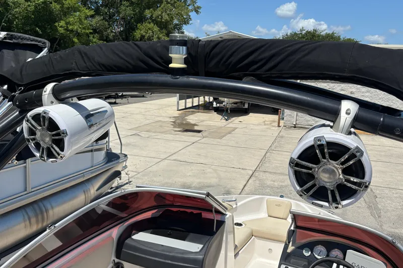 Slide: The Image of 2018 Regal 1900 ES Bowrider with mounted speakers and sleek interior design. - 15