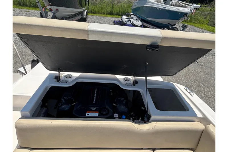 Slide: The Image of 2018 Regal 1900 ES Bowrider engine compartment open, showcasing Volvo Penta 200 V6 engine. - 19