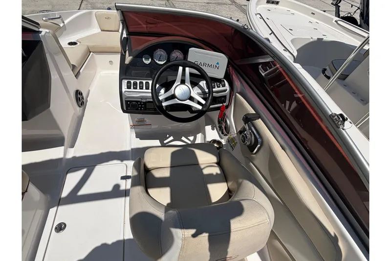 Slide: The Image of 2018 Regal 1900 ES Bowrider interior with steering wheel and Garmin navigation system. - 21