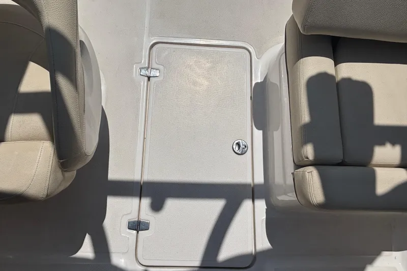 Slide: The Image of Interior of 2018 Regal 1900 ES Bowrider showing seating and storage compartment. - 24
