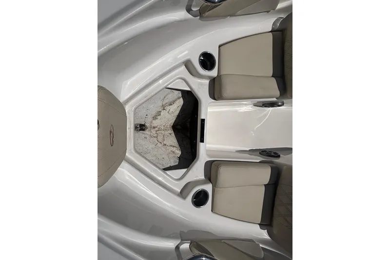Slide: The Image of 2018 Regal 1900 ES Bowrider interior with beige seating and cup holders. - 9