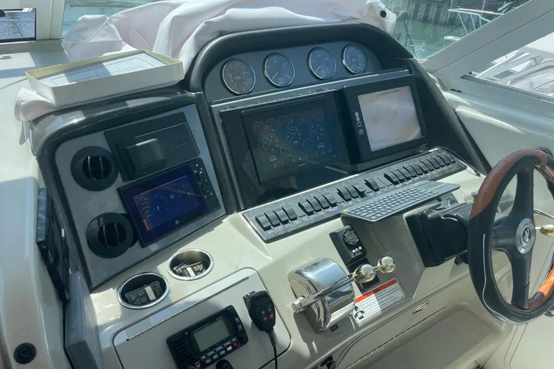 Slide: The Image of 2006 Sea Ray 40 Motor Yacht helm with advanced navigation and control systems. - 10