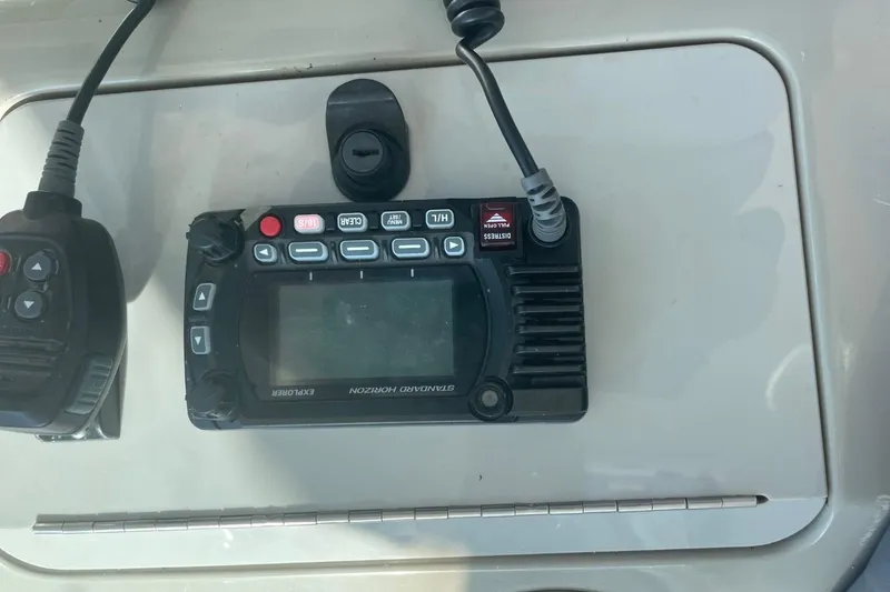 Slide: The Image of Marine radio equipment on a 2006 Sea Ray 40 Motor Yacht dashboard. - 11