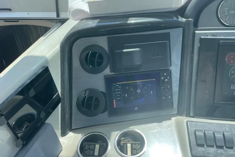 Slide: The Image of Control panel of a 2006 Sea Ray 40 Motor Yacht with navigation display. - 13