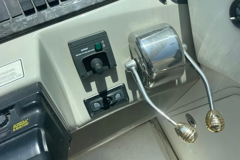 Slide: The Image of Control panel of a 2006 Sea Ray 40 Motor Yacht with bow thruster and throttle levers. - 14