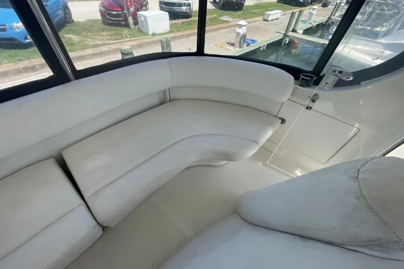 Slide: The Image of Interior of 2006 Sea Ray 40 Motor Yacht with white seating and windows. - 19