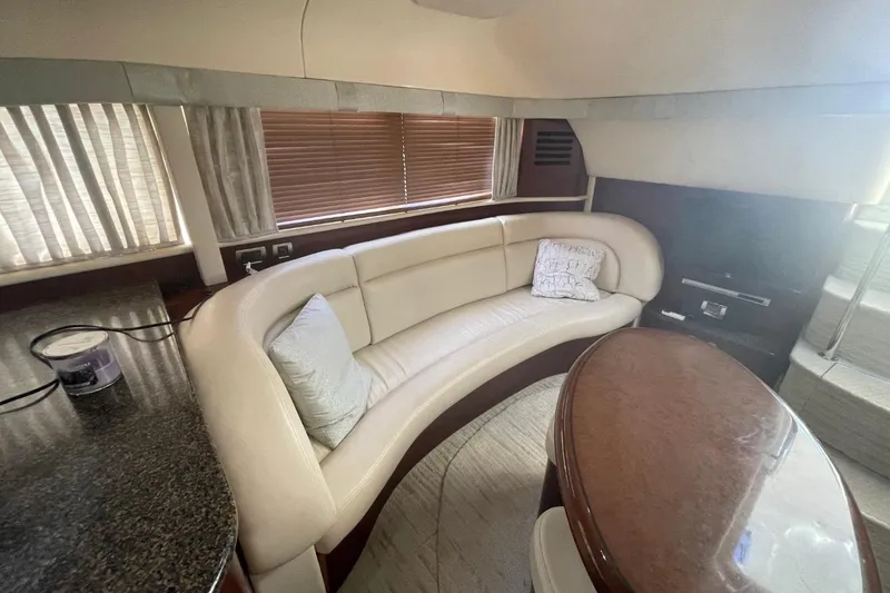 Slide: The Image of Luxurious interior of a 2006 Sea Ray 40 Motor Yacht with elegant seating and table. - 21