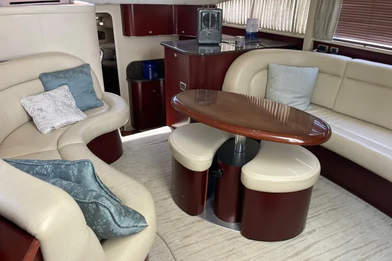 Slide: The Image of Luxurious interior of a 2006 Sea Ray 40 Motor Yacht with elegant seating and wooden table. - 27