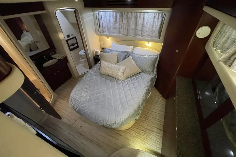 Slide: The Image of Luxurious bedroom interior of 2006 Sea Ray 40 Motor Yacht with cozy bedding. - 28