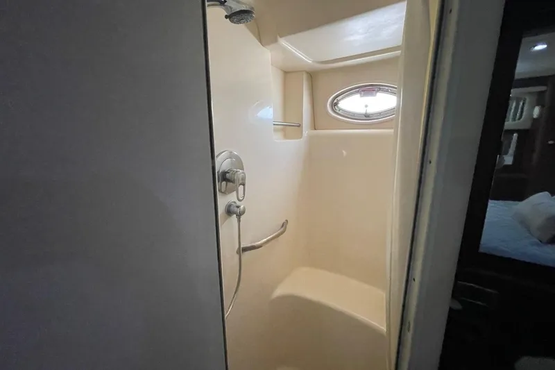 Slide: The Image of Shower area in 2006 Sea Ray 40 Motor Yacht with oval window and modern fixtures. - 30