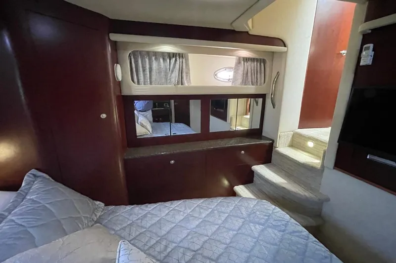 Slide: The Image of Interior of 2006 Sea Ray 40 Motor Yacht with cozy bedroom and elegant wood finishes. - 35