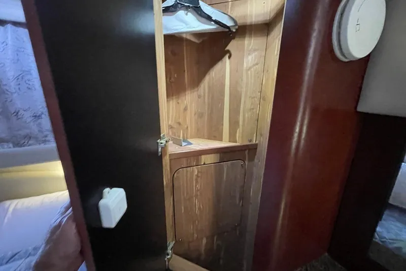 Slide: The Image of Wooden closet interior on a 2006 Sea Ray 40 Motor Yacht. - 36