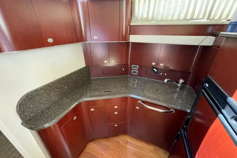 Slide: The Image of Luxurious kitchen area in a 2006 Sea Ray 40 Motor Yacht with sleek cabinetry. - 37