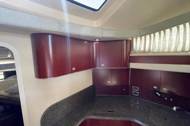 Slide: The Image of Interior of a 2006 Sea Ray 40 Motor Yacht with wood cabinetry and granite countertops. - 38