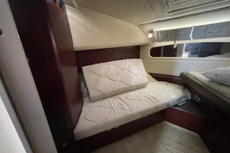 Slide: The Image of Interior cabin of 2006 Sea Ray 40 Motor Yacht with cozy bedding and elegant design. - 44