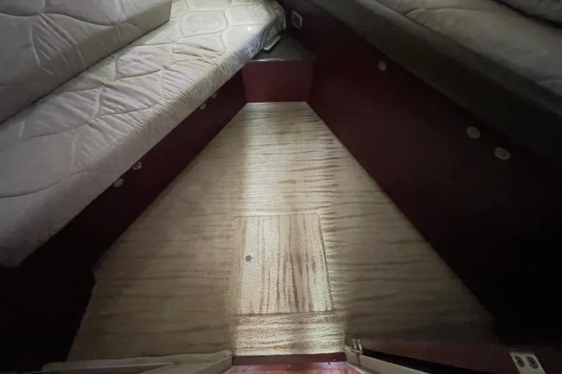 Slide: The Image of Interior cabin of 2006 Sea Ray 40 Motor Yacht with cushioned seating and carpeted floor. - 45