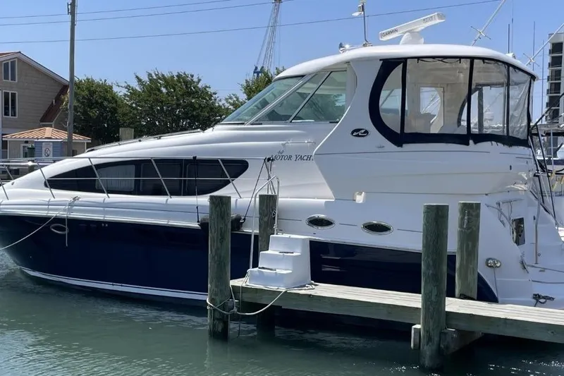 Slide: The Image of 2006 Sea Ray 40 Motor Yacht docked at marina, featuring sleek design and modern amenities. - 5