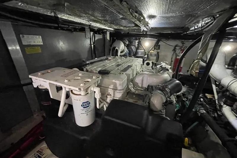 Slide: The Image of Engine room of a 2006 Sea Ray 40 Motor Yacht, showcasing mechanical components and systems. - 51