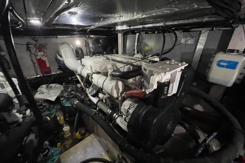 Slide: The Image of Engine room of a 2006 Sea Ray 40 Motor Yacht, showcasing mechanical components. - 52