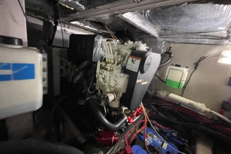 Slide: The Image of Engine room of a 2006 Sea Ray 40 Motor Yacht, showcasing mechanical components. - 55