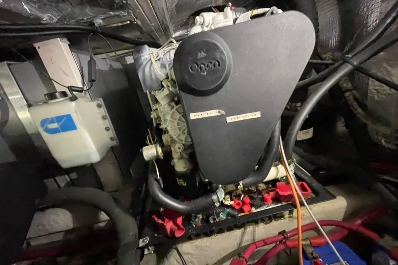 Slide: The Image of Engine compartment of a 2006 Sea Ray 40 Motor Yacht, featuring Onan generator. - 56