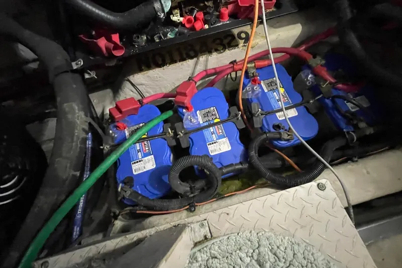 Slide: The Image of Battery compartment of a 2006 Sea Ray 40 Motor Yacht with blue marine batteries. - 57