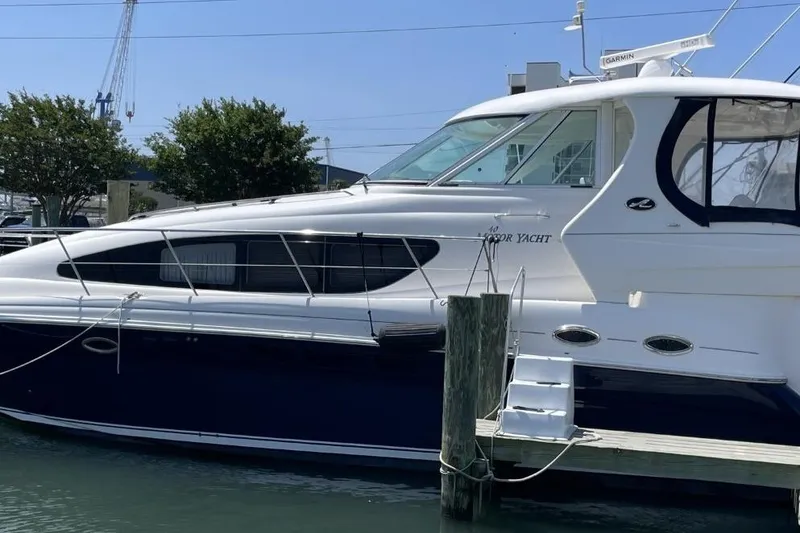 Slide: The Image of 2006 Sea Ray 40 Motor Yacht docked at marina, showcasing sleek design and modern features. - 6