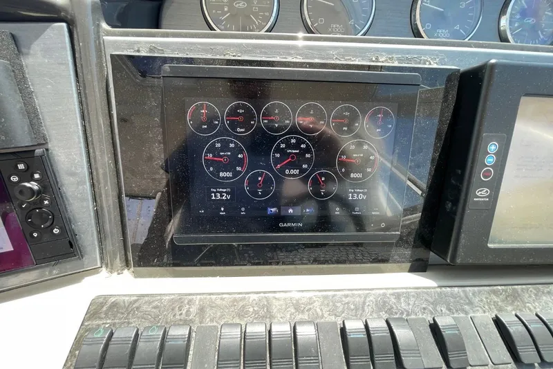 Slide: The Image of Garmin display on 2006 Sea Ray 40 Motor Yacht dashboard showing engine metrics. - 61