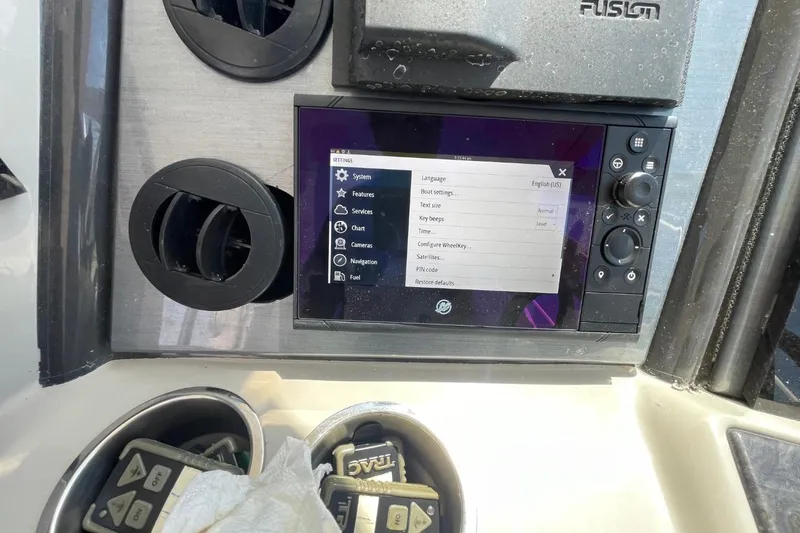 Slide: The Image of Control panel of a 2006 Sea Ray 40 Motor Yacht with navigation settings displayed. - 62