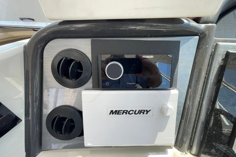 Slide: The Image of Control panel of a 2006 Sea Ray 40 Motor Yacht with Fusion and Mercury systems. - 65