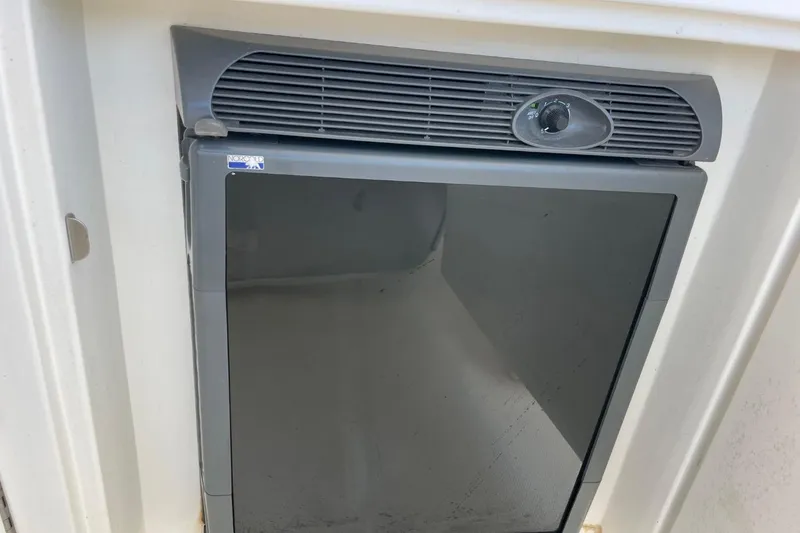 Slide: The Image of Built-in refrigerator on a 2006 Sea Ray 40 Motor Yacht, featuring a sleek black door. - 66