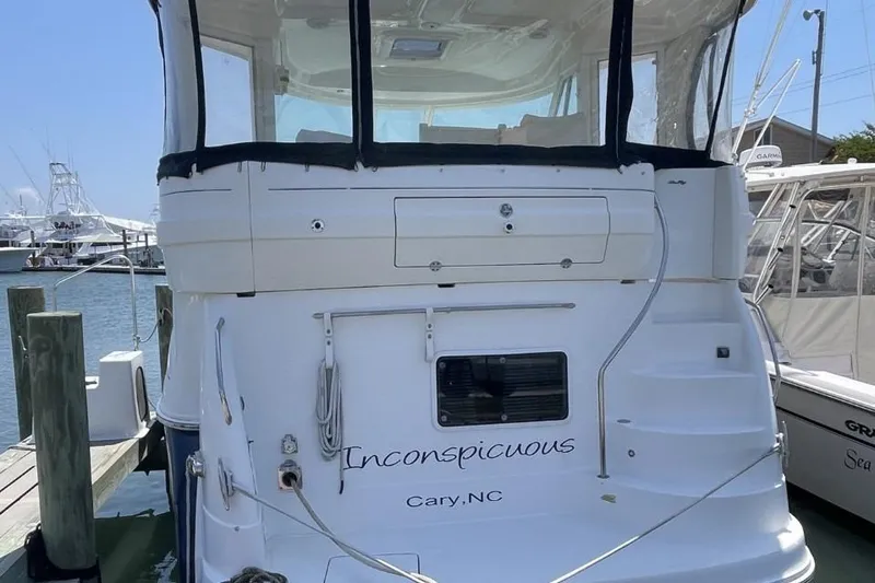 Slide: The Image of 2006 Sea Ray 40 Motor Yacht docked, named "Inconspicuous," located in Cary, NC. - 8