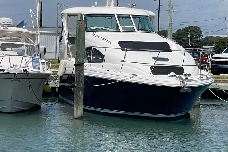Slide: The Image of 2006 Sea Ray 40 Motor Yacht docked in a marina. - 0