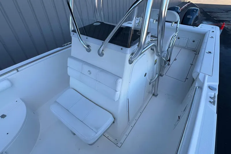Slide: The Image of 2006 Edgewater 245CC boat interior with seating and console, showcasing sleek design and functionality. - 13