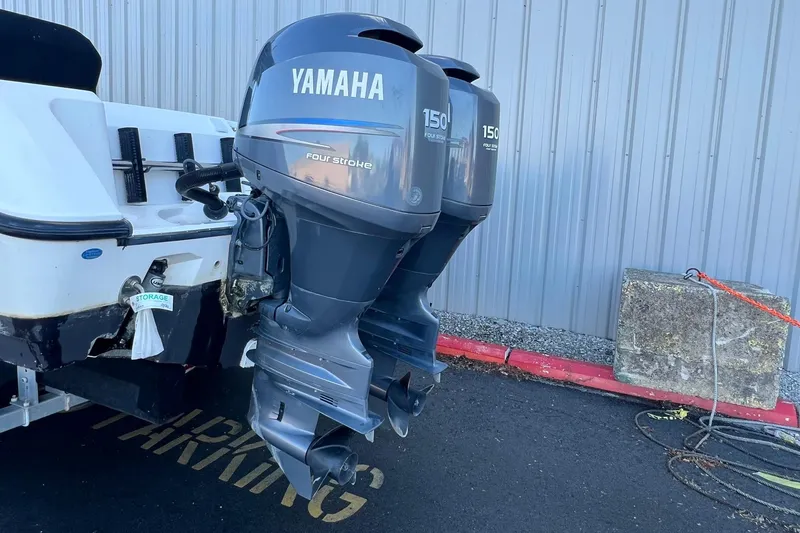 Slide: The Image of Twin Yamaha 150 horsepower four-stroke outboard motors on a 2006 Edgewater 245CC boat. - 30