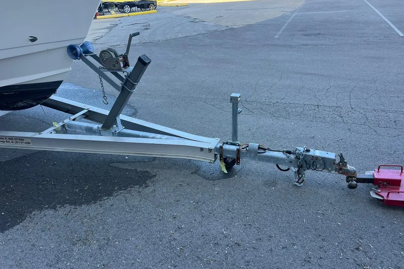 Slide: The Image of Trailer hitch of a 2006 Edgewater 245CC boat on asphalt pavement. - 40