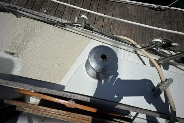 Slide: The Image of Deck of a 1977 Ericson 35 sailboat with winch and wooden trim. - 10