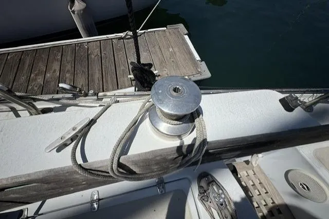 Slide: The Image of Deck of a 1977 Ericson 35 sailboat with winch and ropes. - 11