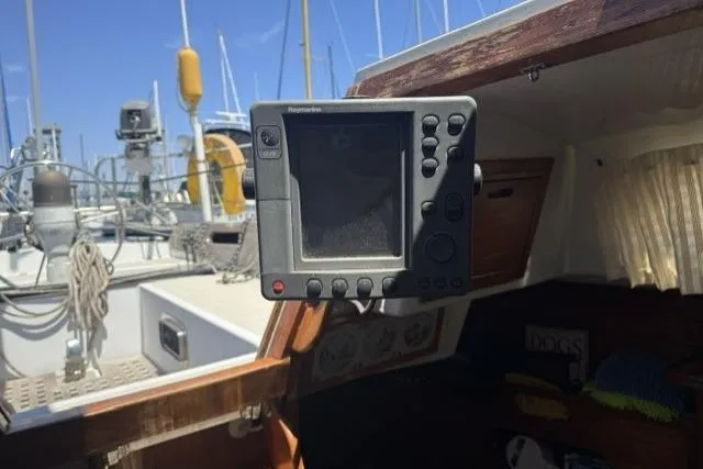 Slide: The Image of Cockpit of a 1977 Ericson 35 sailboat with navigation equipment. - 13
