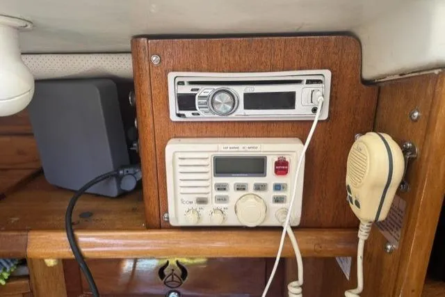 Slide: The Image of 1977 Ericson 35 yacht interior with radio and communication equipment. - 18