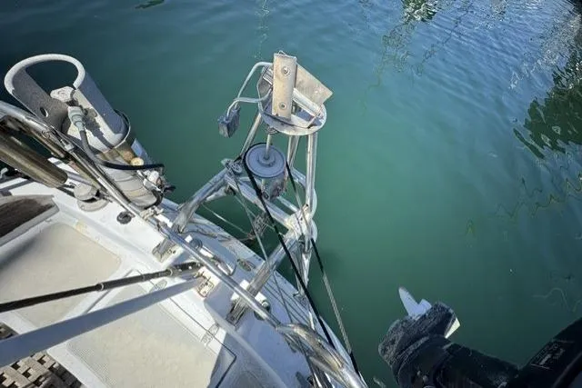 Slide: The Image of Deck view of a 1977 Ericson 35 sailboat with clear water reflection. - 6