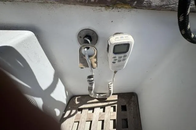 Slide: The Image of Vintage Ericson 35 sailboat cockpit with mounted radio, 1977 model. - 9