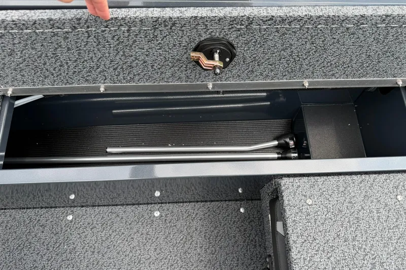 Slide: The Image of Storage compartment of 2027 Lund 1675 Adventure Sport boat, featuring organized interior space. - 19