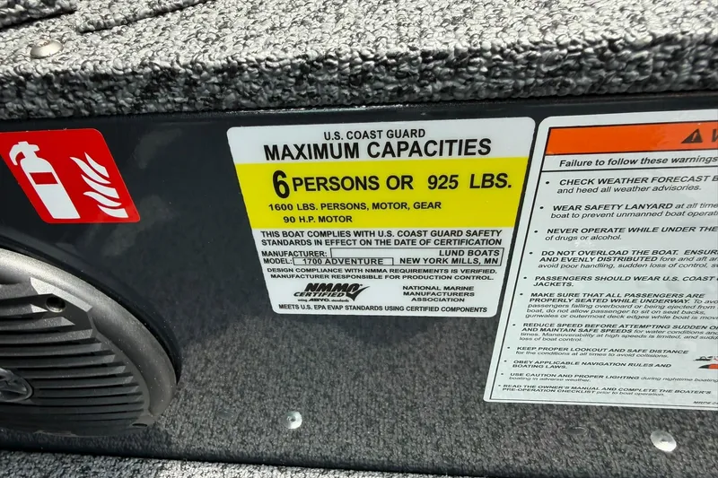Slide: The Image of U.S. Coast Guard capacity label on 2027 Lund 1675 Adventure Sport boat, max 6 persons or 925 lbs. - 21