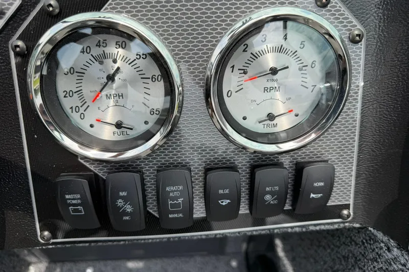 Slide: The Image of Dashboard of 2027 Lund 1675 Adventure Sport with speedometer, RPM gauge, and control switches. - 15