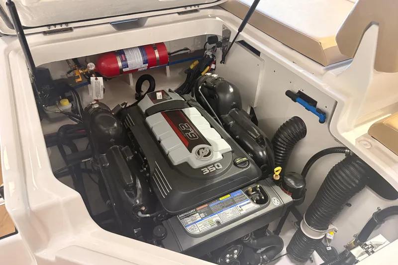 Slide: The Image of Engine compartment of 2026 Sea Ray SDX 250 Surf boat, featuring a powerful 350 engine. - 17