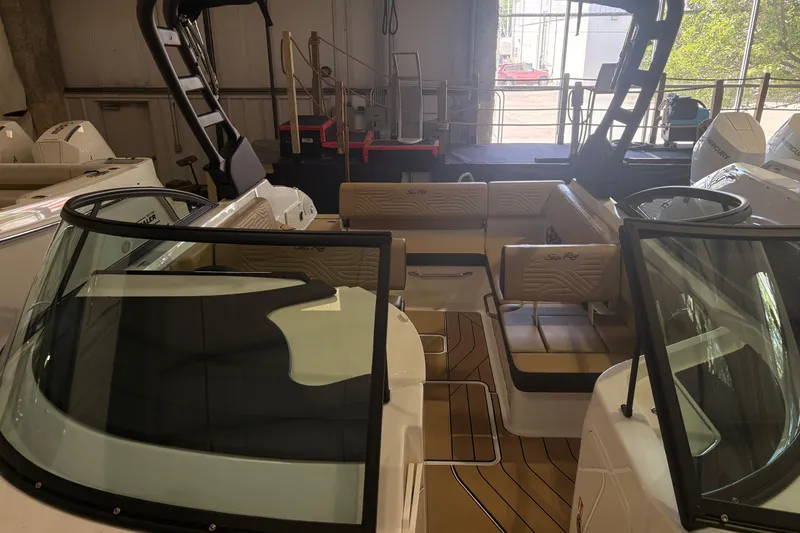Slide: The Image of 2026 Sea Ray SDX 250 Surf boat interior with luxurious seating and sleek design. - 21