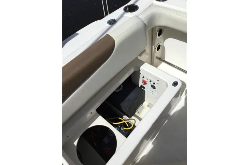 Slide: The Image of 2017 Robalo R222 Center Console boat storage compartment with battery and wiring. - 7