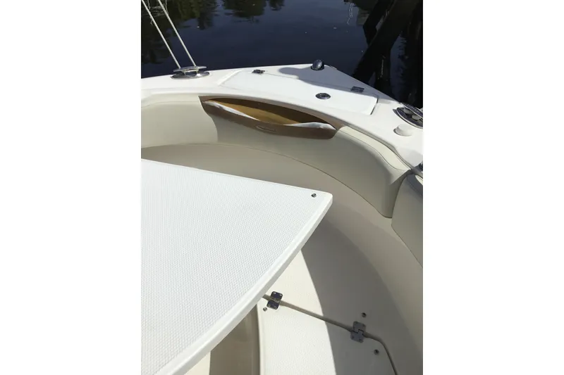 Slide: The Image of 2017 Robalo R222 Center Console boat interior with seating and storage compartments. - 4
